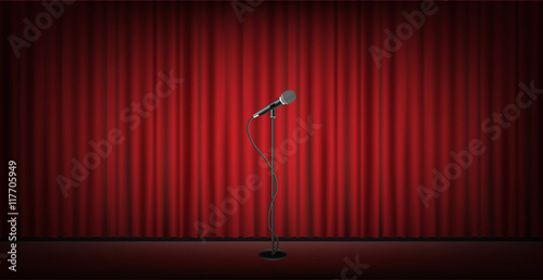 microphone stand on stage with red curtain background