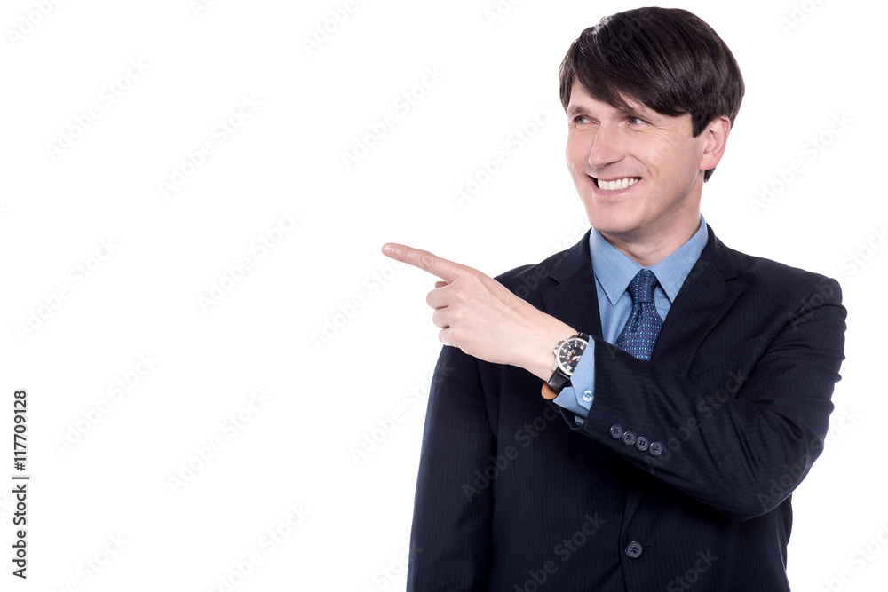 Handsome entrepreneur pointing towards something Handsome entrepreneur pointing towards something