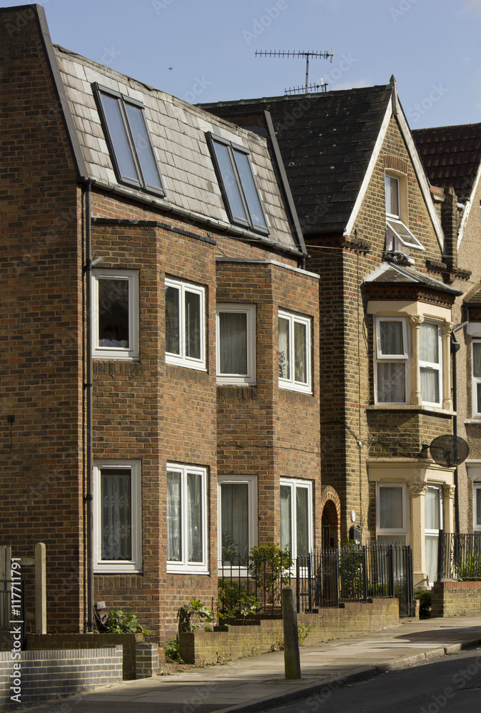 LONDON, UNITED KINGDOM - SEPTEMBER 12 2015: Traditional English terraced house in a row, in Woolwich Arsenal London district LONDON, UNITED KINGDOM - SEPTEMBER 12 2015: Traditional English terraced house in a row, in Woolwich Arsenal London district