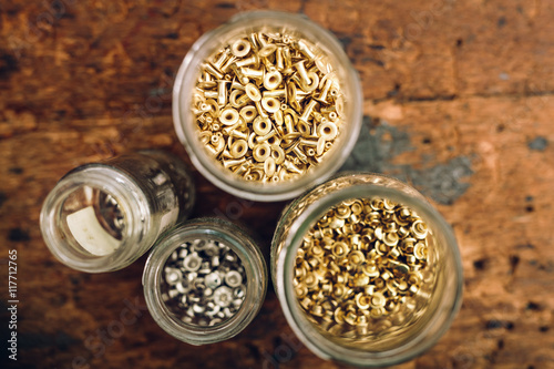 Jars with rivets on workbench