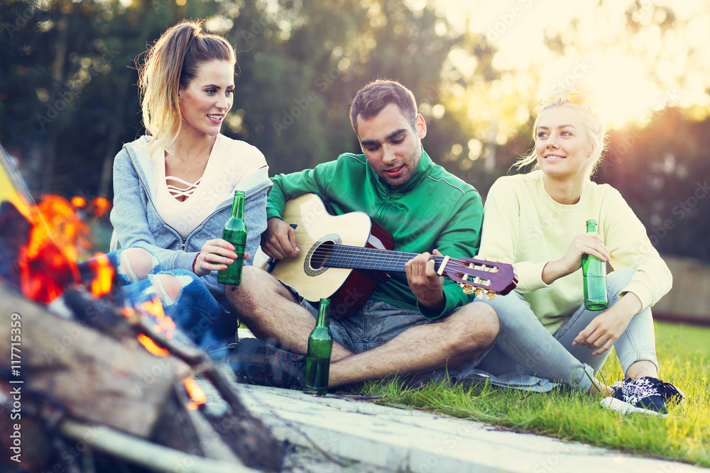 Group of friends having campfire