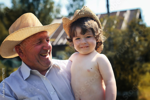 old man with child in hat