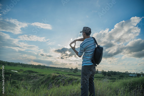 man travelling in nature with backpack © stcom