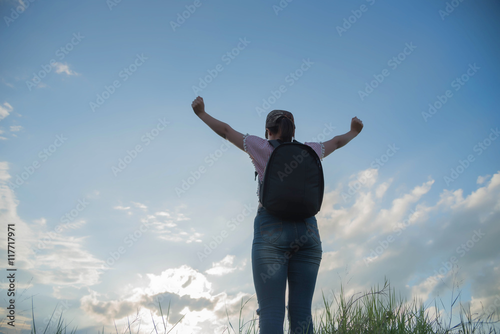cheering young woman hiker open arms to snow mountains in the di cheering young woman hiker open arms to snow mountains in the di