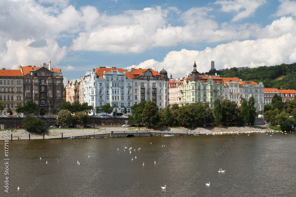 Summer in Prague. Nice view of the Vltava River and the promenade.