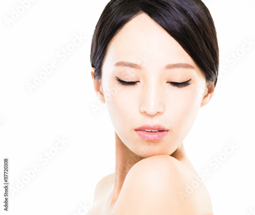 closeup young woman face with clean skin