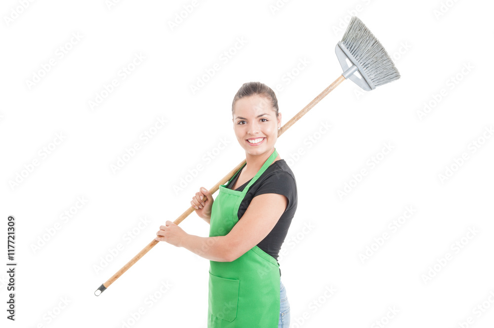 Smiling cleaning girl holding brush on her shoulder Smiling cleaning girl holding brush on her shoulder