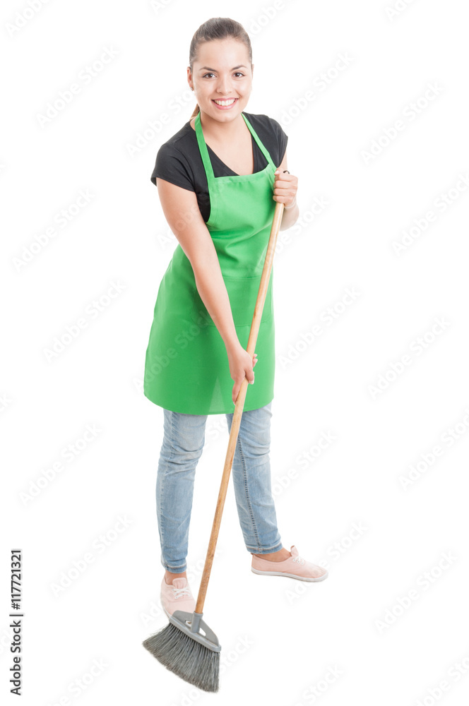 Cheerful cleaning woman brushing the floor Cheerful cleaning woman brushing the floor