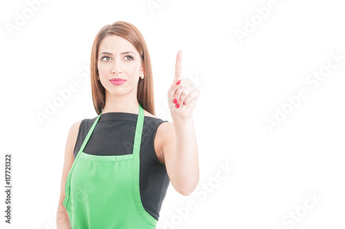Young smiling employee pointing at something on screen