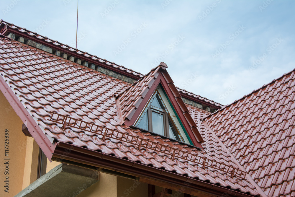 Red metallic roof with attic and snow guards