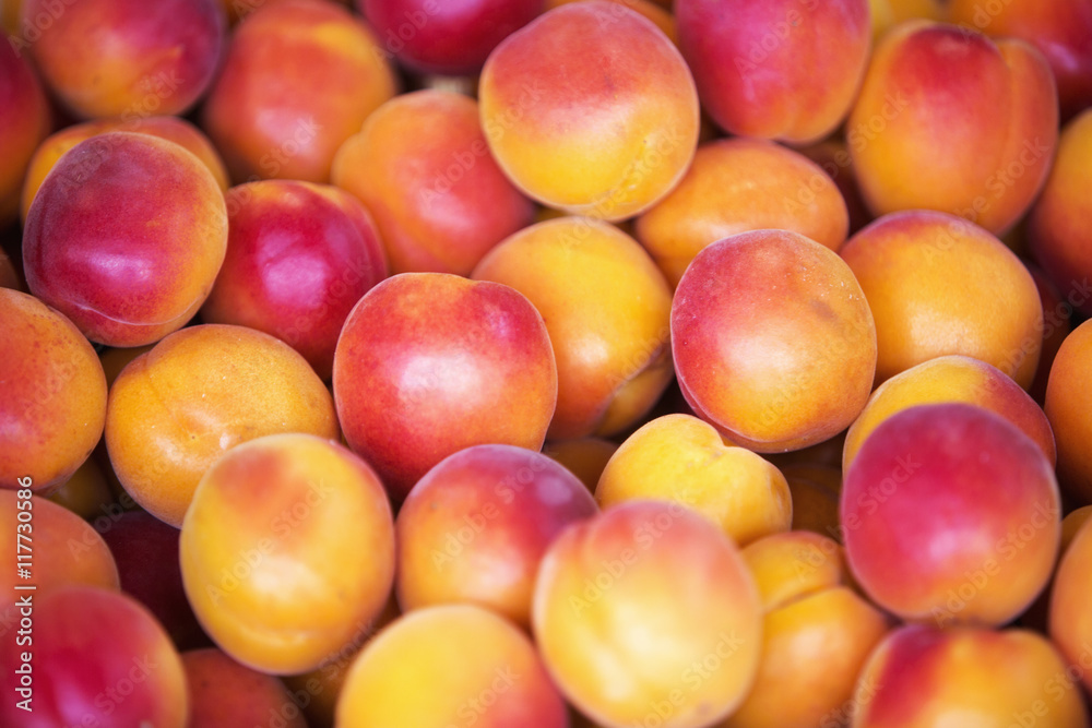 close up of peaches at fruit stand