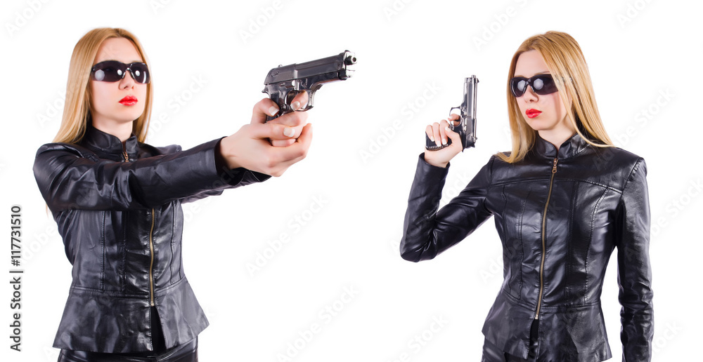 Woman in leather costume with gun isolated on white Woman in leather costume with gun isolated on white