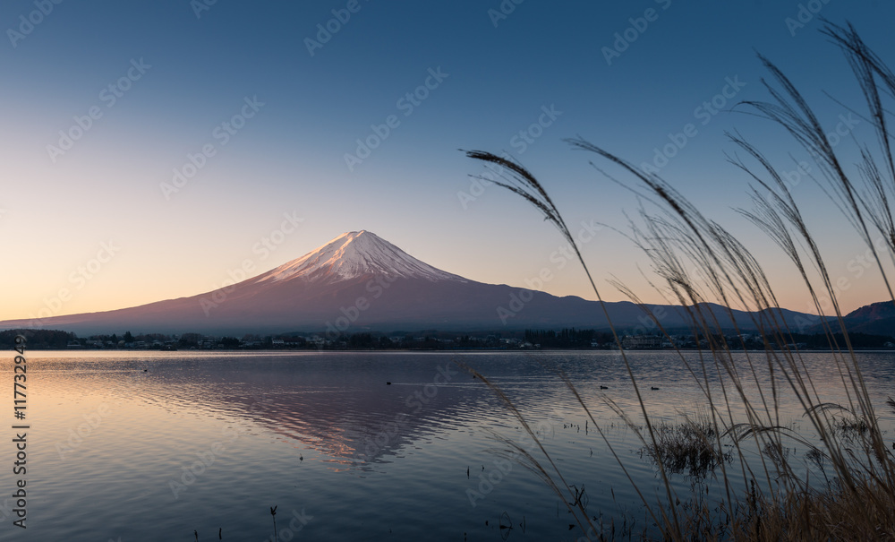 Mountain Fuji and reflections on lake Kawaguchi at dawn