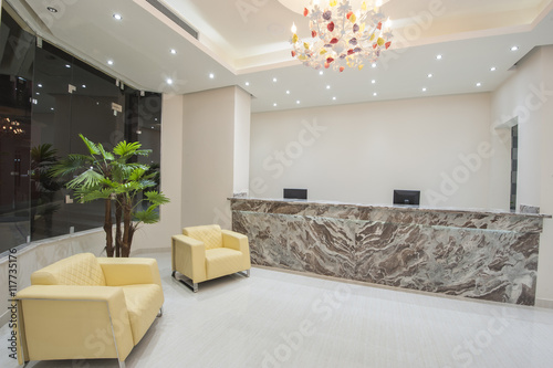 Interior of a luxury hotel lobby reception area photo