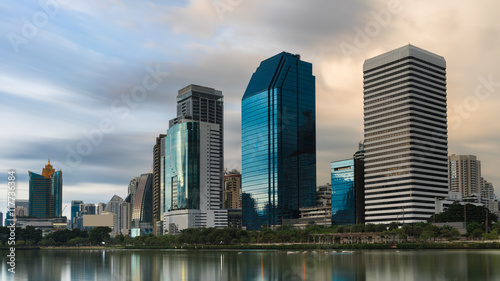 Long exposure image of Benchakitti park , green lung of Bangkok , in the evening with reflection , Thailand
