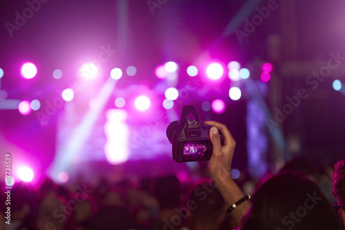 Fan Taking Photo On Camera At Music Festival