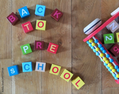 Back to pre school sentence written with colorful wood cubes