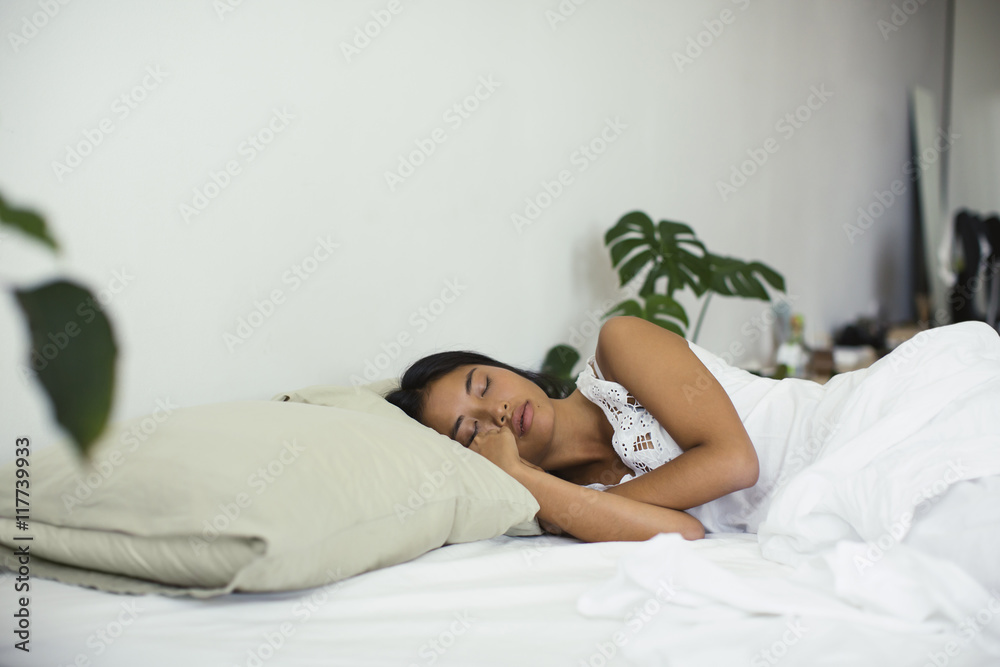Young woman sleeping in bed Young woman sleeping in bed