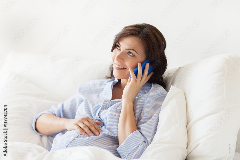 happy pregnant woman calling on smartphone at home happy pregnant woman calling on smartphone at home