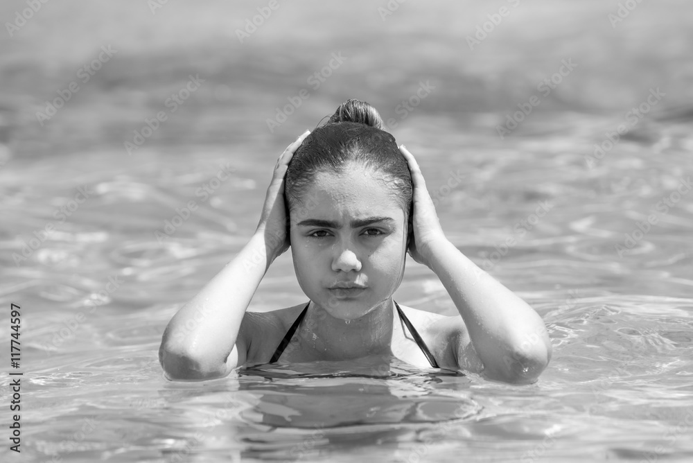 Portrait of young woman swimming