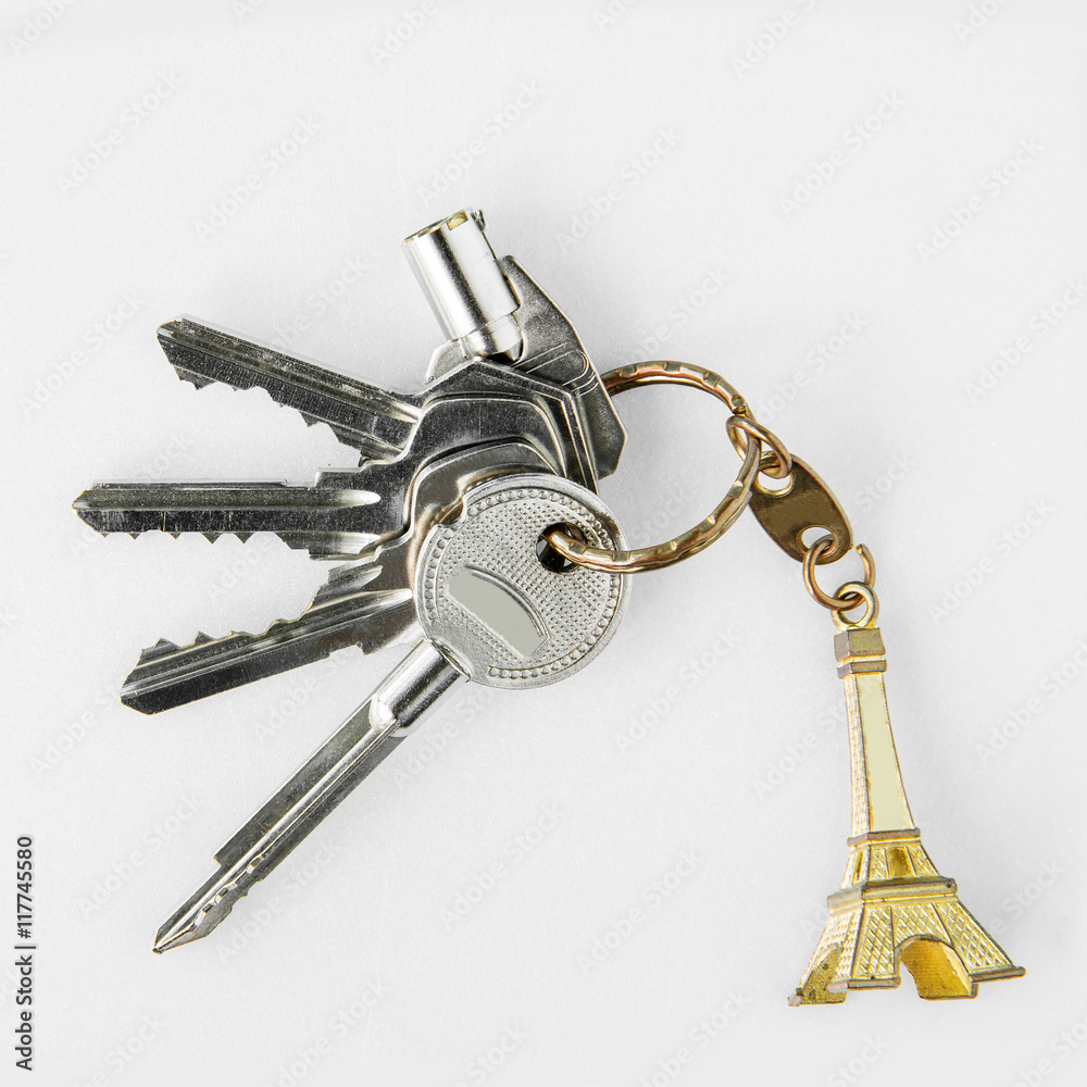 Keys with key chain of mini eiffel tower from Paris, France on a Keys with key chain of mini eiffel tower from Paris, France on a