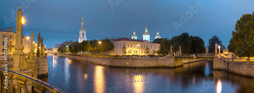 Night view on illuminated Kryukov Canal, Griboedov Canal and St. Nicholas Naval Cathedral, St. Petersburg, Russia.