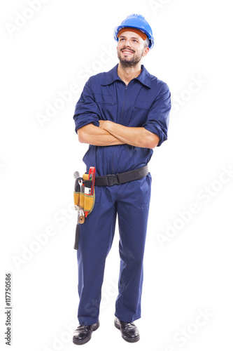 Young worker with arms crossed on white background