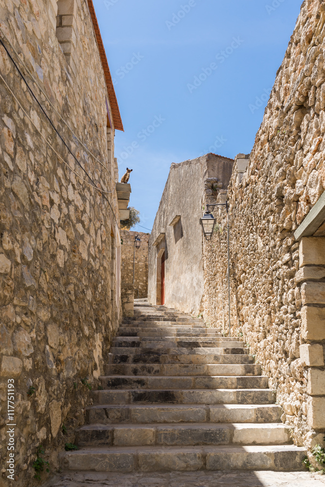 The village Prasies situated south-east of Rethimno. The Venetian style is always tangible in the small town on Crete. Narrow alleys meander through the village Old buildings remember the past The village Prasies situated south-east of Rethimno. The Venetian style is always tangible in the small town on Crete. Narrow alleys meander through the village Old buildings remember the past