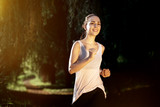 Athletic woman jogging in nature