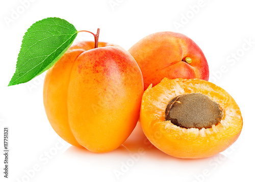 Fresh apricots with leaf close-up isolated on a white background.