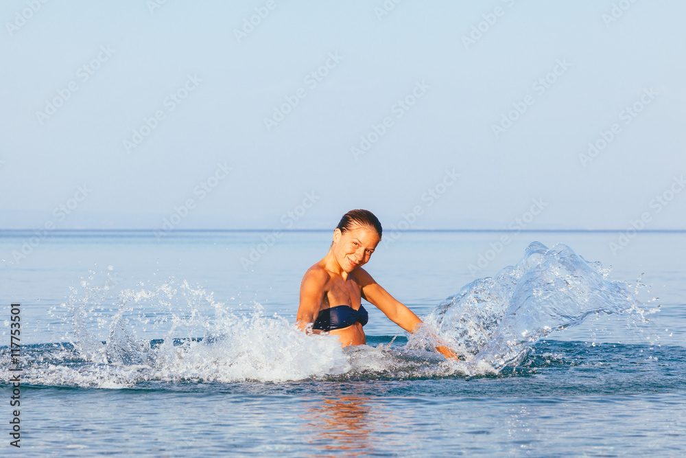 Young cute woman having fun in the sea Young cute woman having fun in the sea