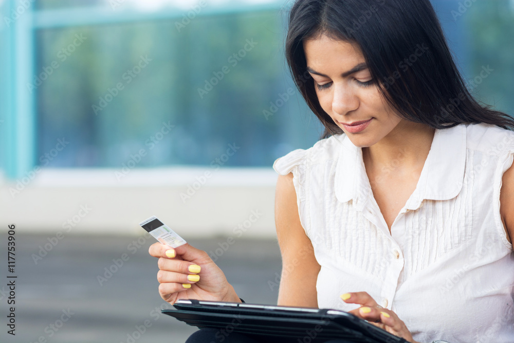 Internet shopping woman online with tablet pc and credit card