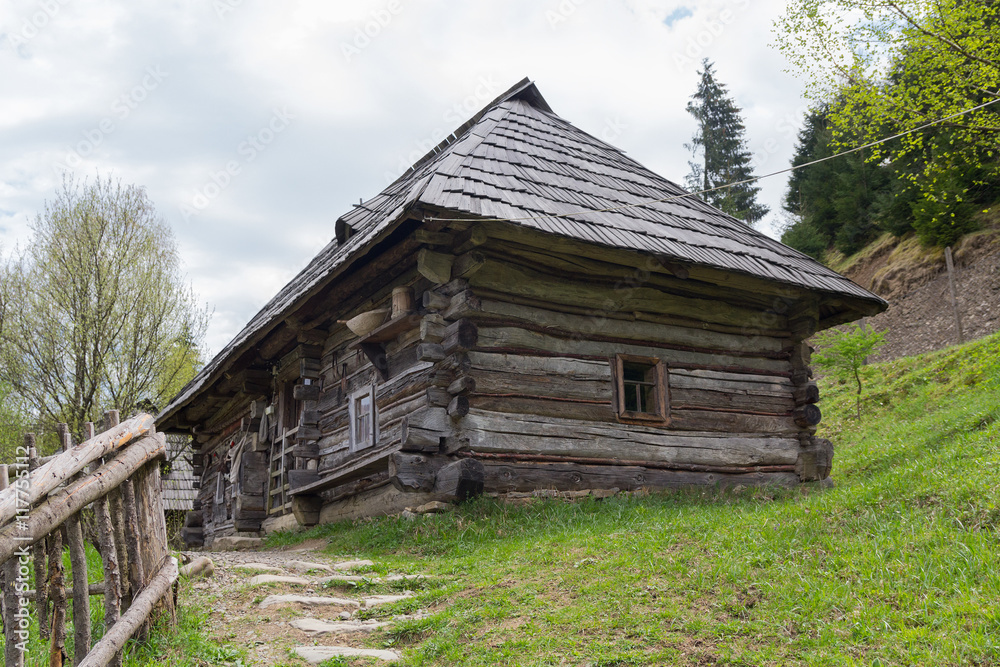 Fototapeta premium Ancient wooden house Ukrainian peasant. Kolochava, Ukraine