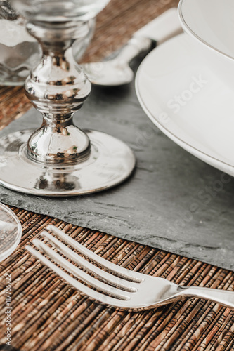 Close-up of silver kitchenware on dining table photo