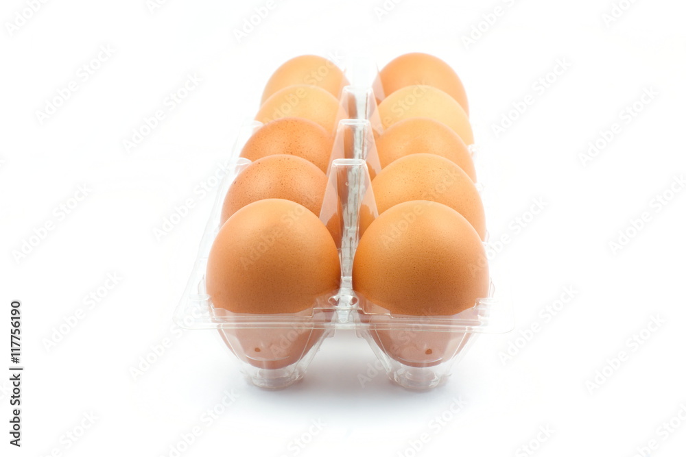 Eggs roll in plastic box on white background Eggs roll in plastic box on white background