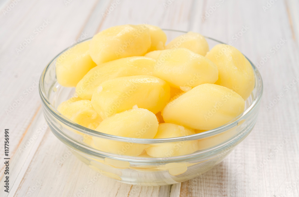 bowl of boiled potatoes on wooden ruched bowl of boiled potatoes on wooden ruched