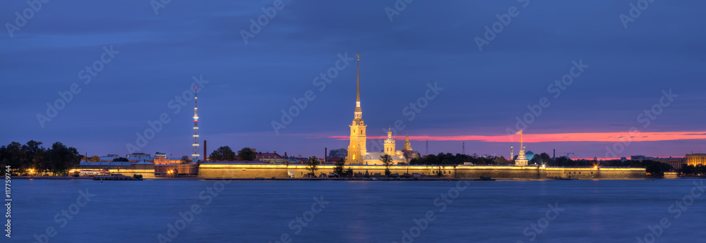 Night panoramic view on the illuminated Peter and Paul Fortress and Neva River, St. Petersburg, Russia.