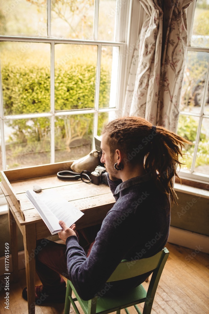 Man reading book at home Man reading book at home