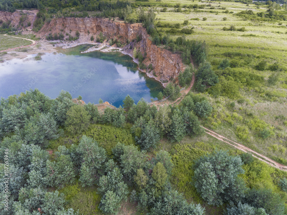 Blue laggon see from above in old sand mine in Poland.