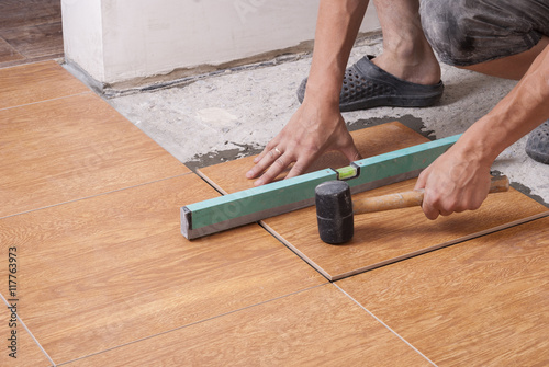 laying tiles on the floor