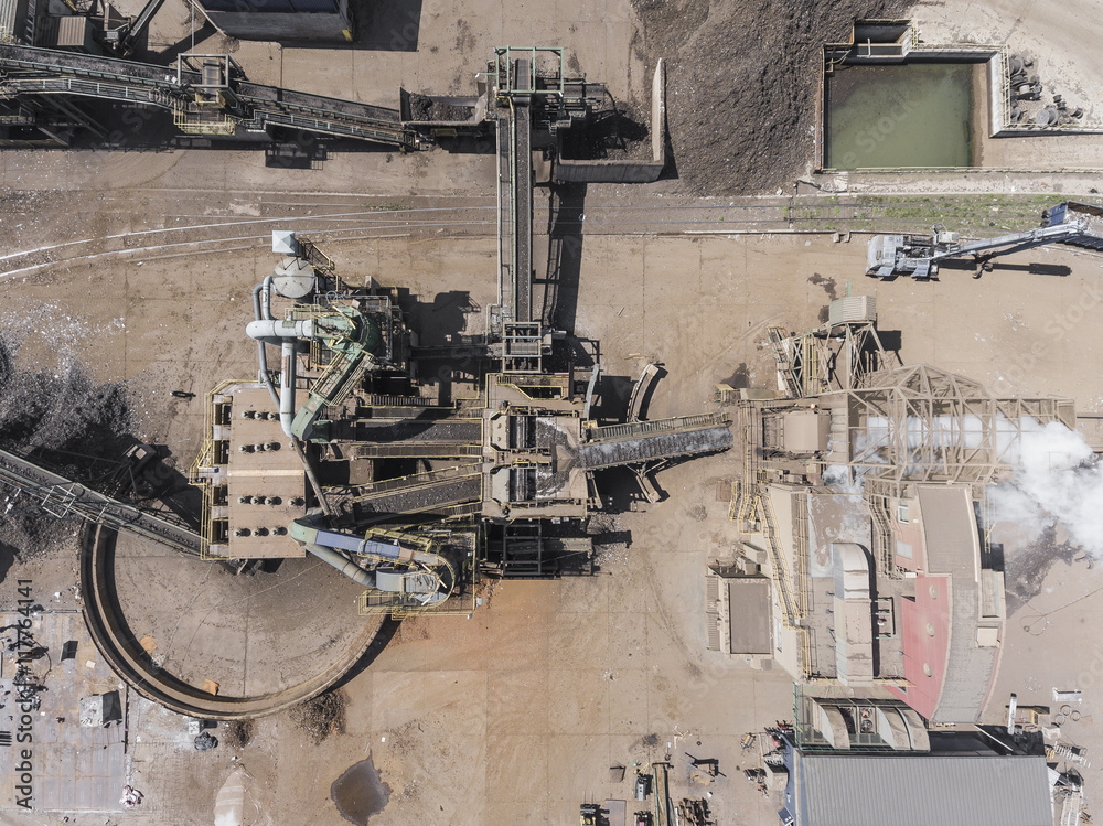 Iron raw materials recycling pile, work machines. Metal waste ju Iron raw materials recycling pile, work machines. Metal waste ju
