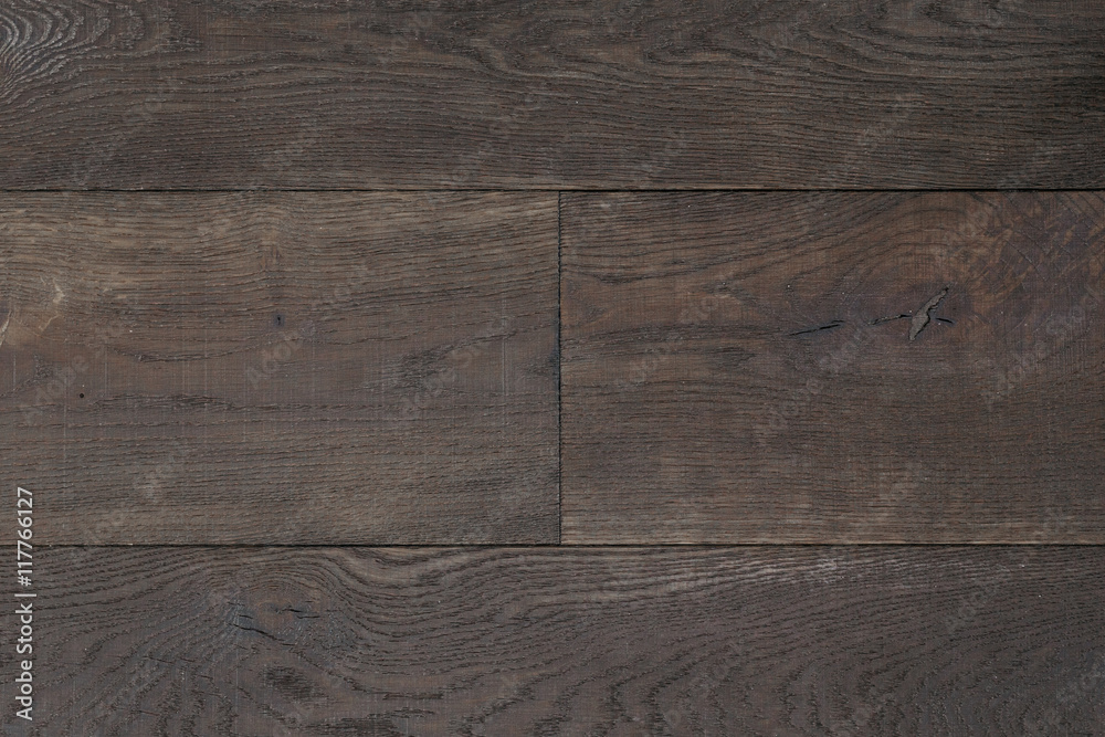 Texture dark brown parquet as abstract texture background, top view. Material wood, oak, maple.