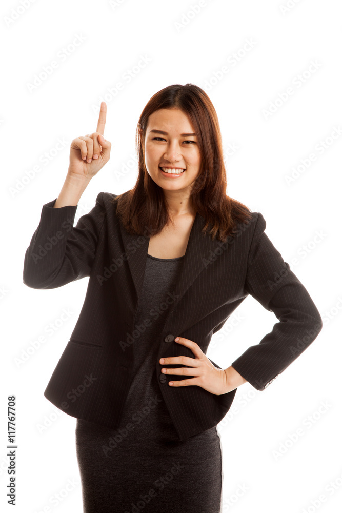 Young Asian businesswoman smile and point up. Young Asian businesswoman smile and point up.