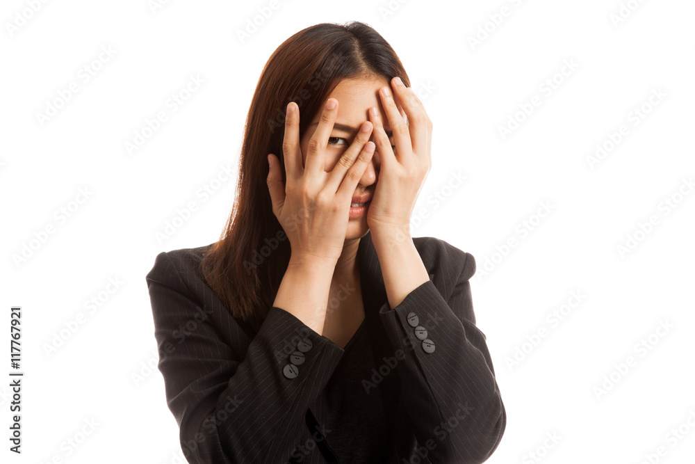 Beautiful young Asian woman peeking through fingers. Beautiful young Asian woman peeking through fingers.