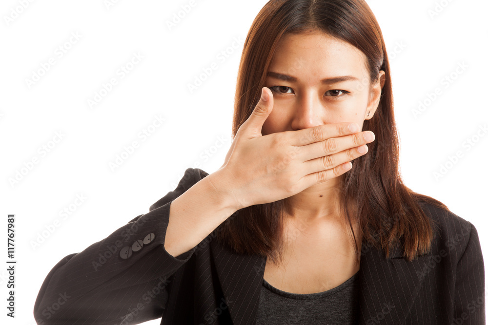 Young Asian business woman close her mouth with hand. Young Asian business woman close her mouth with hand.