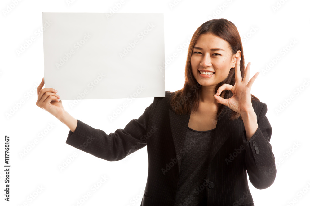 Young Asian business woman show OK with white blank sign. Young Asian business woman show OK with white blank sign.