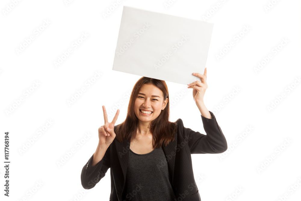 Young Asian business woman show victory sign with blank sign. Young Asian business woman show victory sign with blank sign.