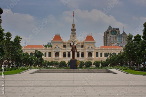 Saigon french government building with the statue of Ho Chi Minh in the front.