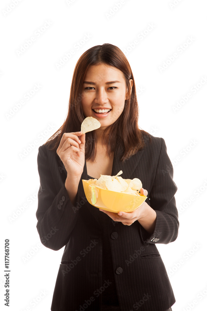 Young Asian woman eat potato chips. Young Asian woman eat potato chips.