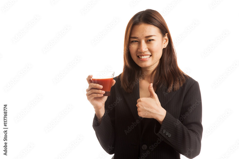 Young Asian business woman thumbs up with tomato juice. Young Asian business woman thumbs up with tomato juice.